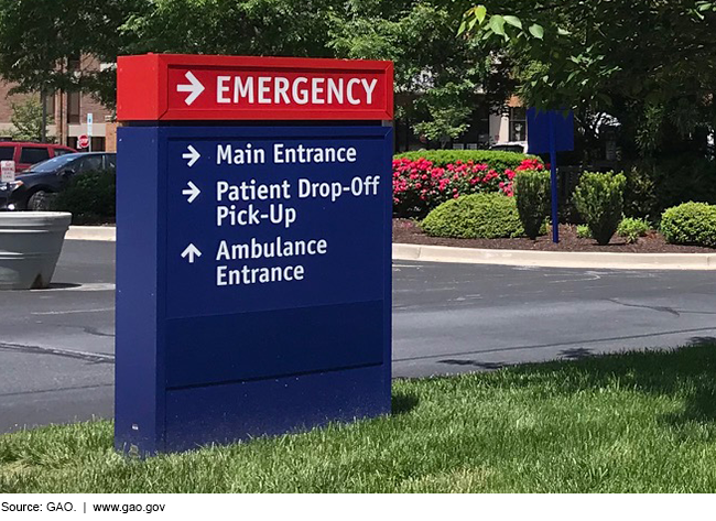 Photo of a hospital sign directing people where to go for services.