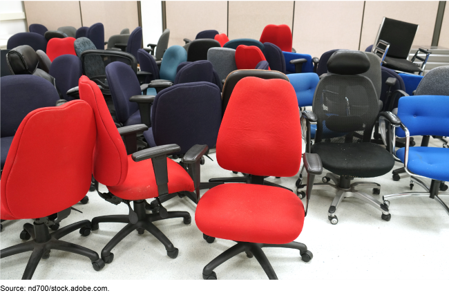 many red, blue, black, and gray office chairs pushed together in a room