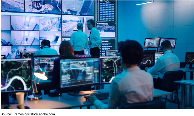 image of people monitoring security footage on computer screens