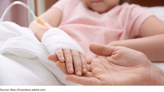 Close up of a pediatric patient's hand with an IV in it, holding an adult's hand. 