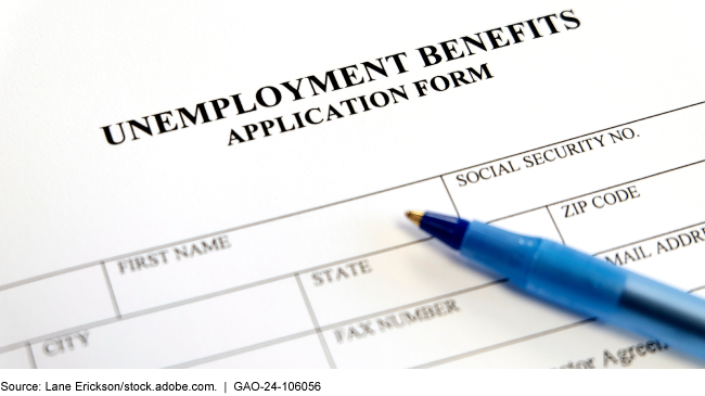 An unemployment application with a pen resting on top of it. 
