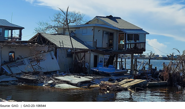 A damaged multi-level house on the water
