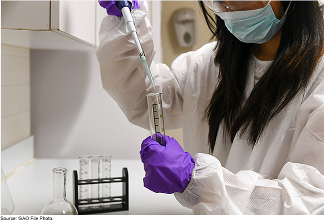 woman holding a test tube in a lab