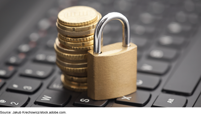 Image of lock and coins on top of a computer keyboard