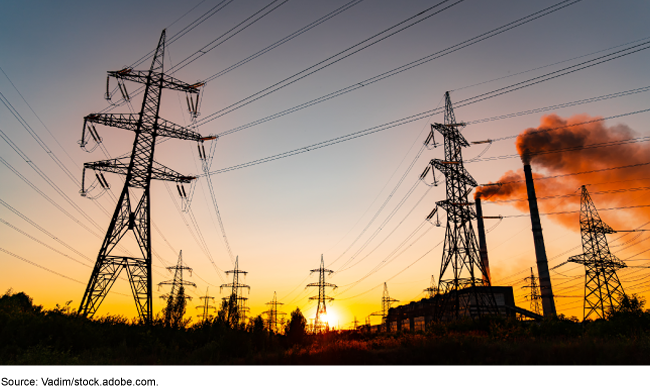 image of power lines against a setting sun