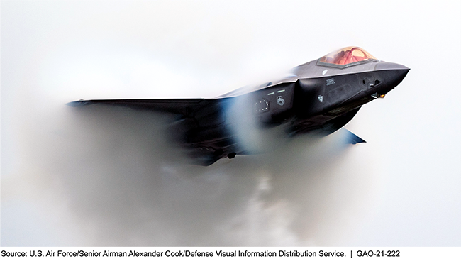 A black F-35A Lightning II Fighter Jet surrounded by a haze of clouds.