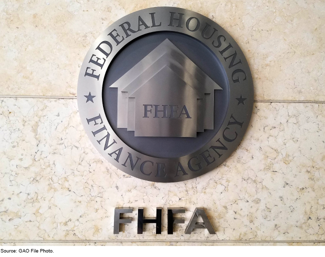 A circular Federal Housing Finance Agency sign on a wall with FHFA below it.