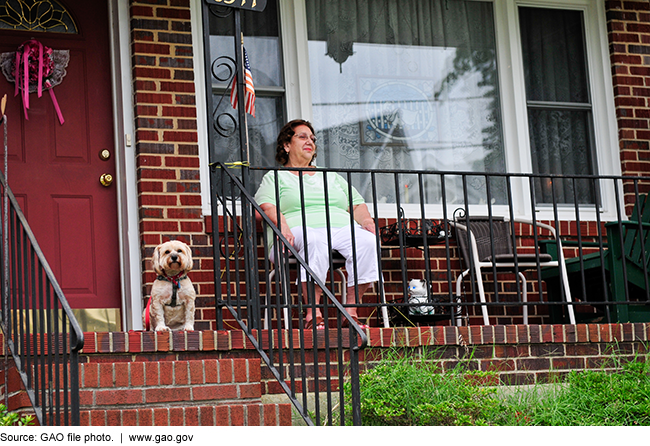 Woman on a porch with her dog