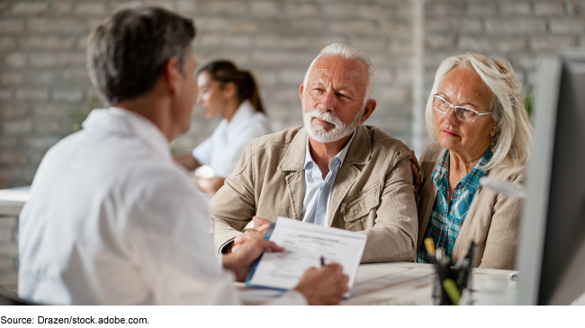 Image of a couple talking to a healthcare provider