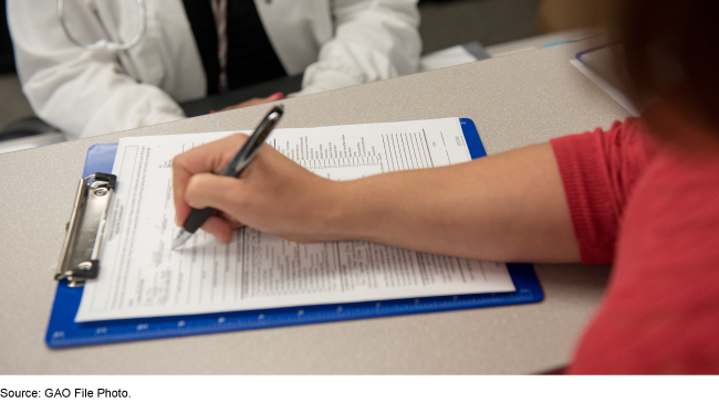 Woman filling out health forms