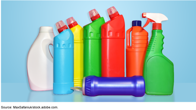 several cleaning products in colored bottles