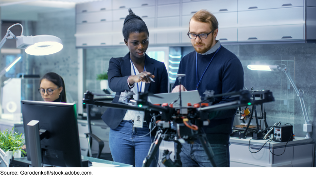 People discussing the development of a drone