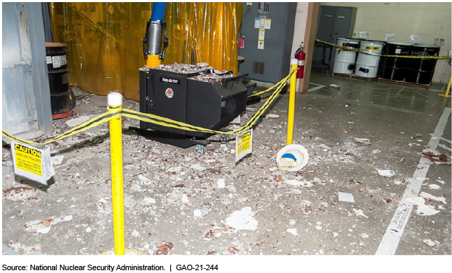 Debris from a partial ceiling collapse in a building for processing lithium