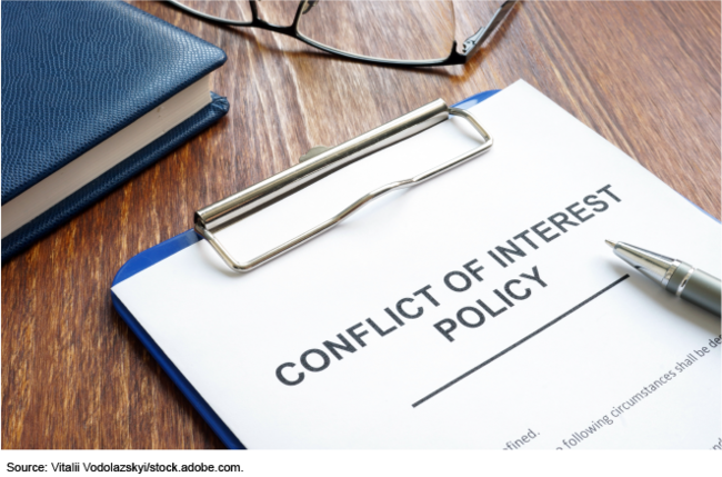 conflict of interest policy on a clipboard