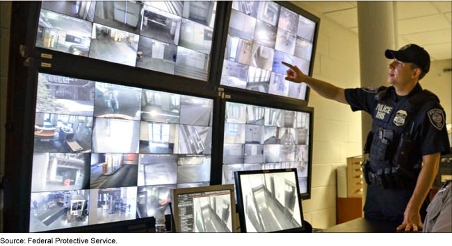 A Federal Protective Service officer looks at security camera footage.