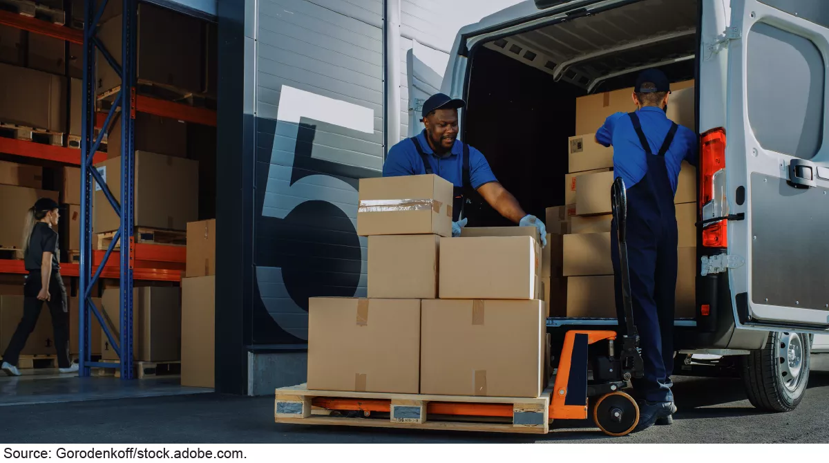 Warehouse workers loading truck