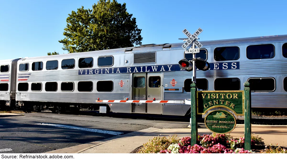 Stock image a silver commuter rail train on a sunny day.
