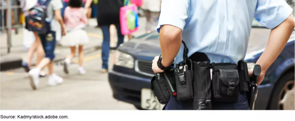 A cop standing in traffic.