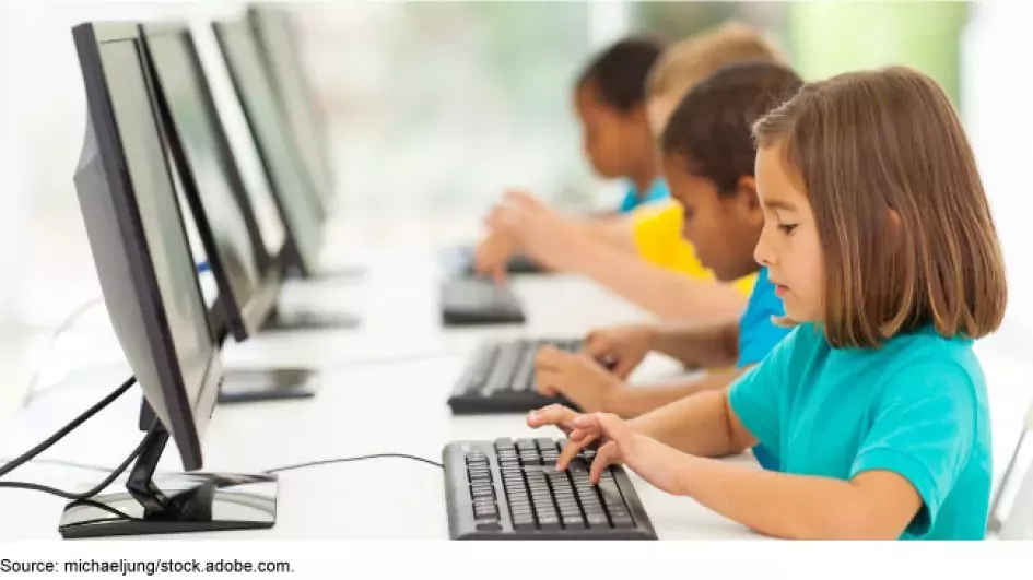 Photographic children at computers