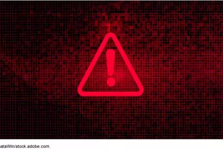 Illustration of a warning sign on a computer screen indicating a ransomware attack.