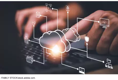 Photo of hands on a laptop computer keyboard with cartoonish icons surrounding it of different systems like a cloud, email, file, screen, documents