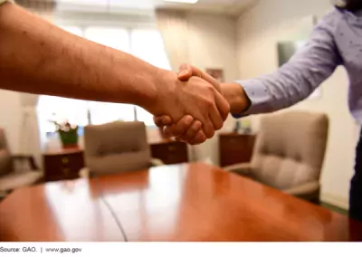 two hands clasped in a handshake