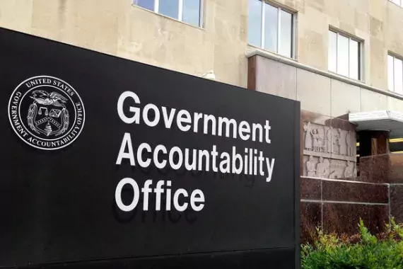 A photo of GAO headquarters in Washington DC. The sign in the photo reads "Government Accountability Office."